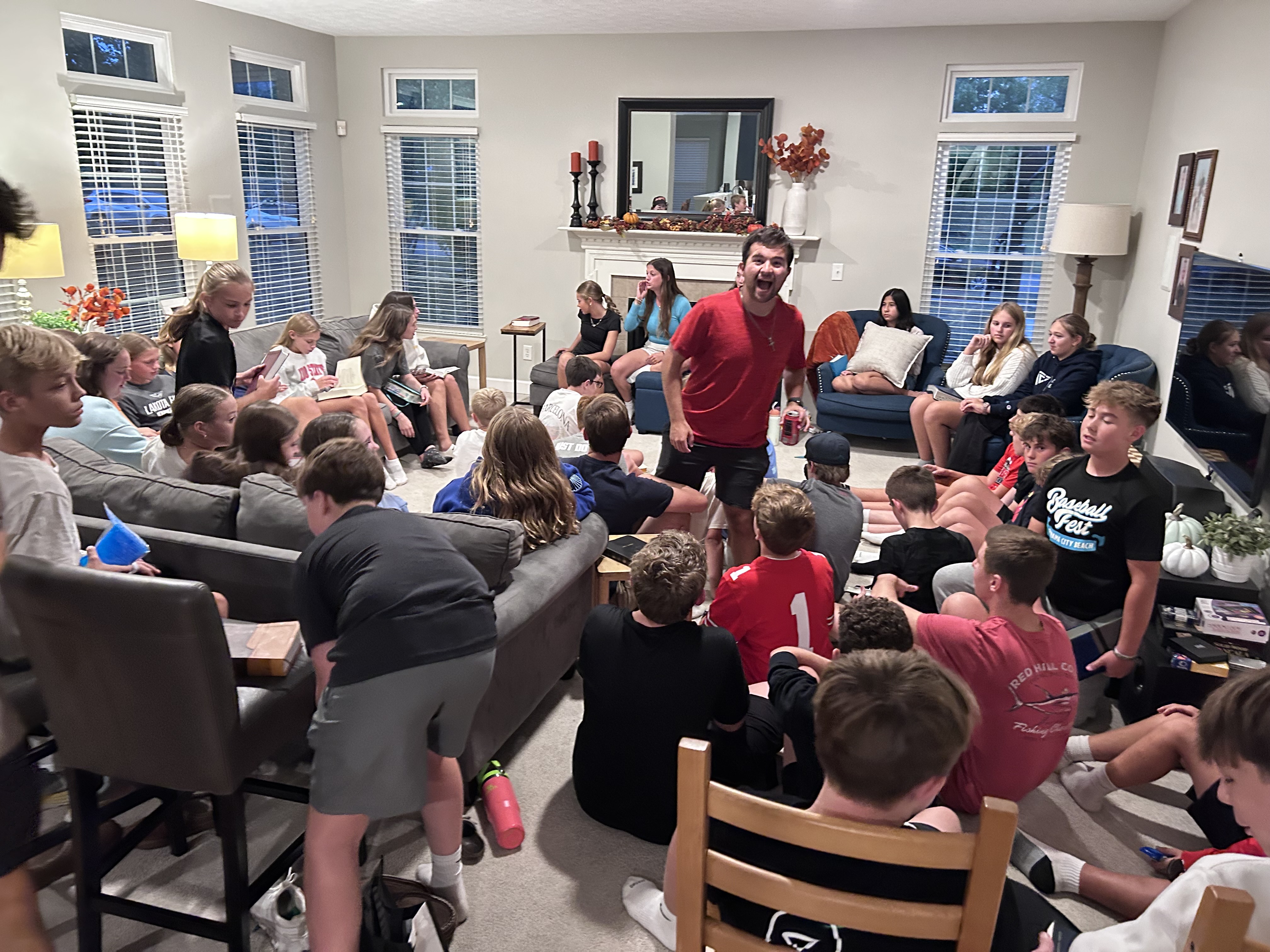 Middle school WyldLife club gathered in a living room